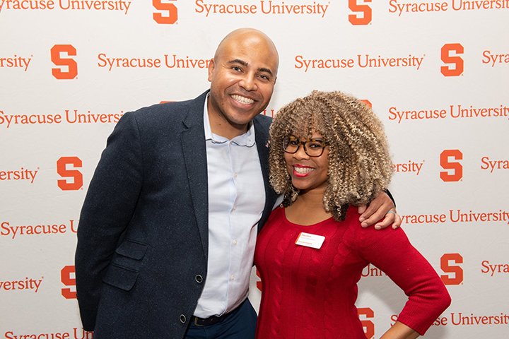 Miko Horn '95 (right) with a guest at the holiday celebration